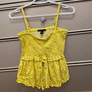 Yellow tank top with middle flare. From Forever 21. Size small